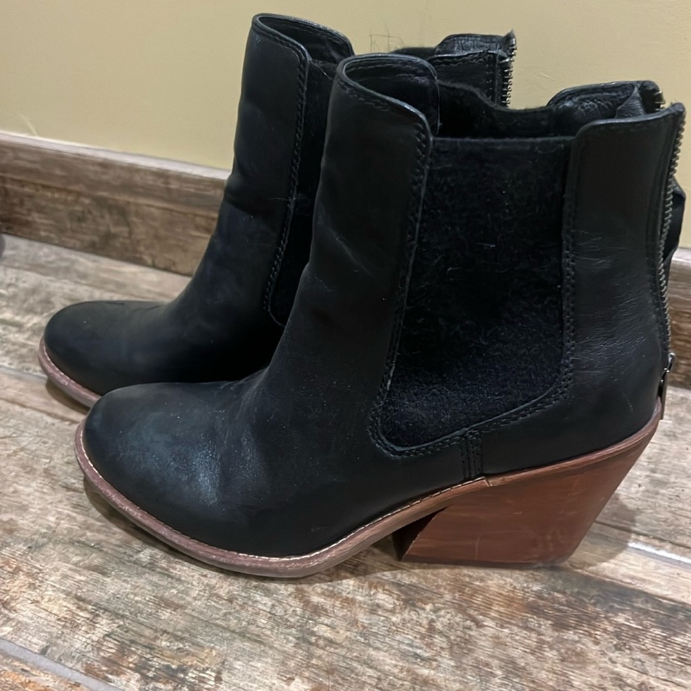 Black hardly worn ankle boots with zippers at the back.